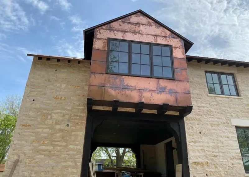 Copper metal panel facade on a stone building for Roof Repair in Arroyo Grande